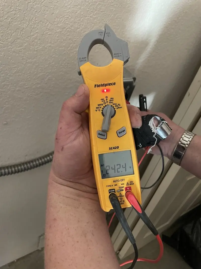 Voltage testing with clamp meter during Generator Installation in Santa Barbara